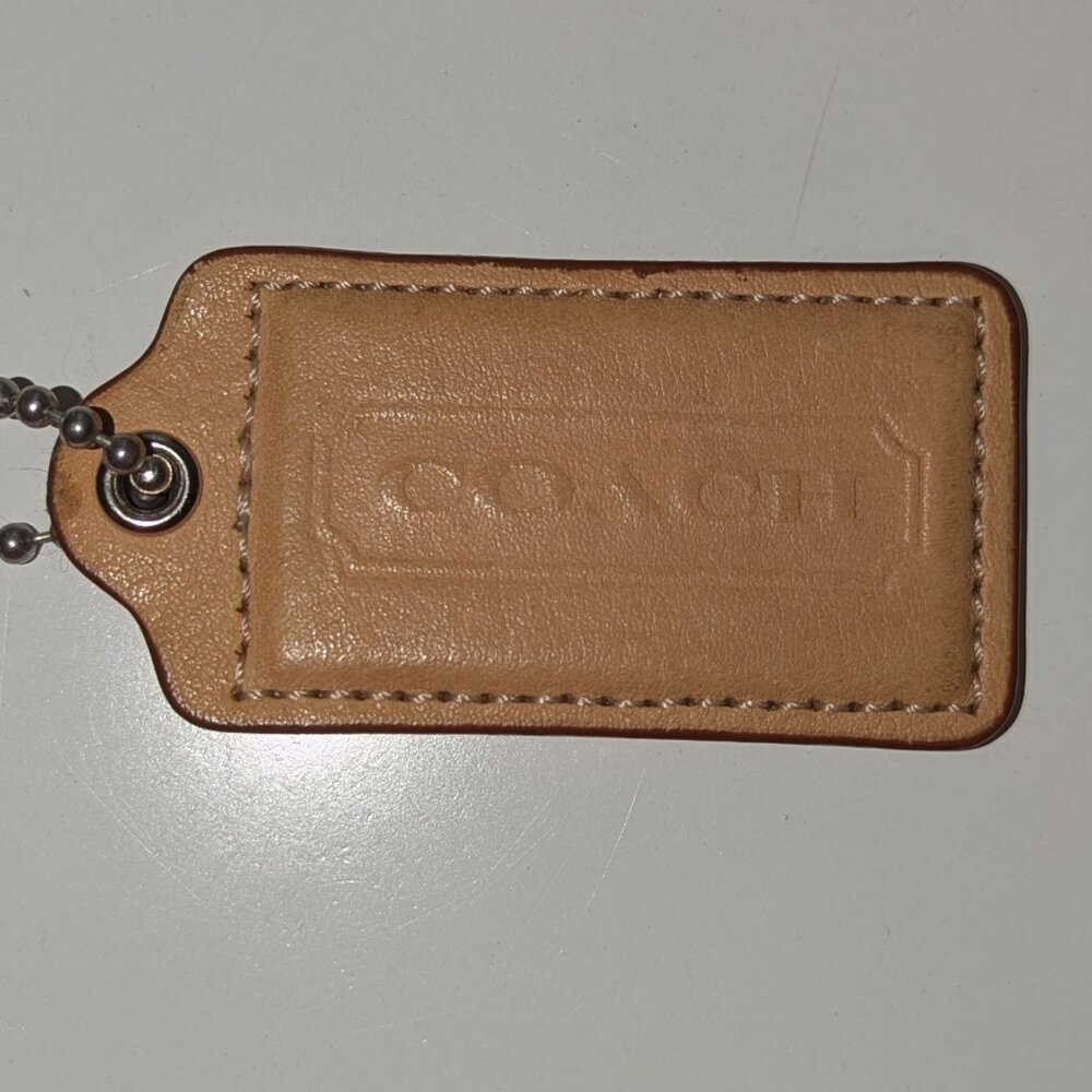 Vintage tan Coach hang tag